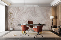 Scandinavian Leaf Elegance wallpaper mural in beige palm fronds behind a black desk and cognac leather chairs in a home office