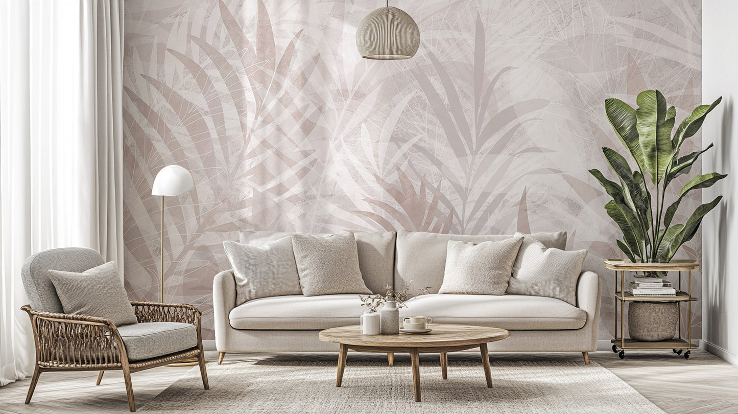 Scandinavian Leaf Elegance wallpaper mural in blush palm leaves behind a cream sofa and rattan armchair in a living room
