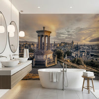 Scottish Skyline wallpaper mural of Edinburgh at sunset behind a freestanding bathtub and wood vanity