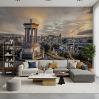 Scottish Skyline wallpaper mural of the Edinburgh skyline above a grey sectional with mustard pillows