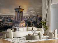 Scottish Skyline wallpaper mural of the Edinburgh skyline above a curved cream sofa on a polka-dot rug