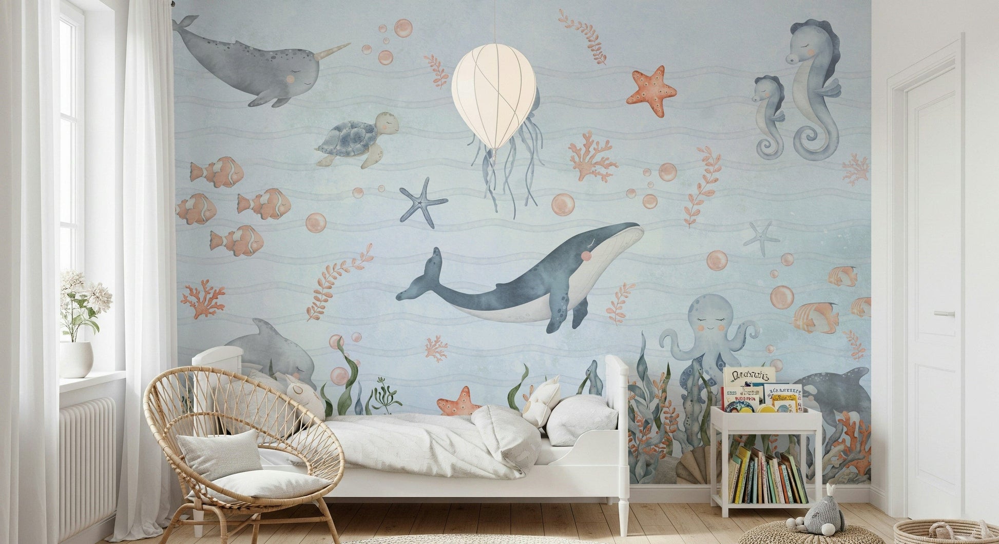 Cute ocean animals wall mural for nursery, pastel color palette, feature wall behind crib