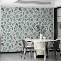 Watercolor shell wallpaper in soft blues on a white background.

