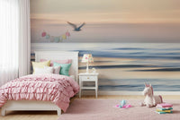 Seagull's Flight Wall Mural behind sofa, coastal apartment wall decor, airy sky scene