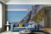 The design has a layered look, showing a long view of the cliffs and the sea.

