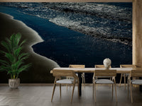 A graceful wave motion wall mural in cool, natural tones.

