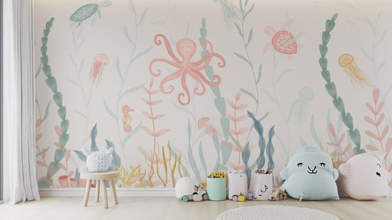 Pastel Marine Symphony wallpaper mural with a pink octopus and seaweed above a wooden stool and cloud cushions in a kids room