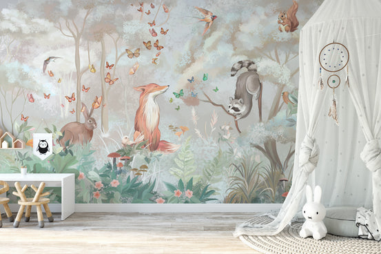 Pastel Forest Animal wallpaper mural with fox, rabbit and raccoon behind a white kids desk and canopy nursery