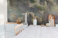 Wildflower Whisper wallpaper mural in muted green tones behind a kitchen counter with teapot, coffee maker and cutting boards