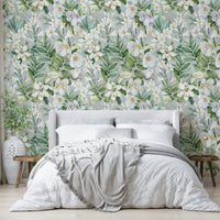 Floral wall mural with detailed botanical elements and soft hues.

