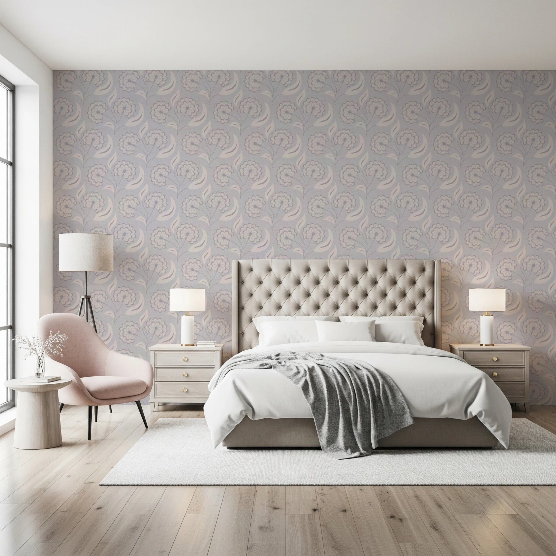 Serene Floral beige wallpaper behind a tufted cream headboard with a pink accent chair in a bright bedroom