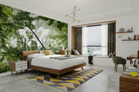 Peaceful view looking up into a green forest canopy on a wall.

