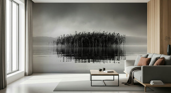 Reflections of Serenity wallpaper mural of black and white misty lake reeds behind a gray sofa in a living room