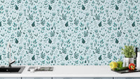 Serene Teal Garden wallpaper with delicate teal florals above a white kitchen counter with herbs and peppers