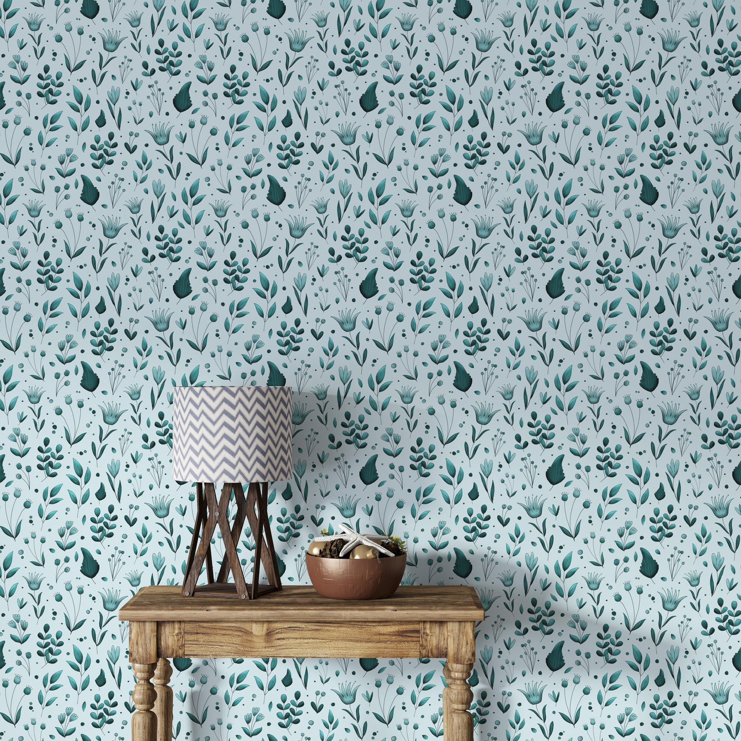 Serene Teal Garden wallpaper behind a wooden console with a chevron table lamp and wooden bowl