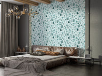 Serene Teal Garden wallpaper above a low bed with bronze satin bedding and a gold chandelier