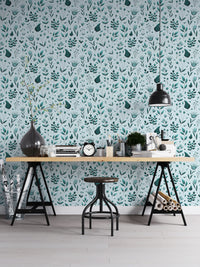 Serene Teal Garden wallpaper as a full-wall mural behind a trestle desk and stool in a home office