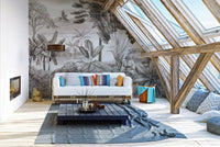 Shooter sitting in jungle wallpaper mural for adventurous decor.
