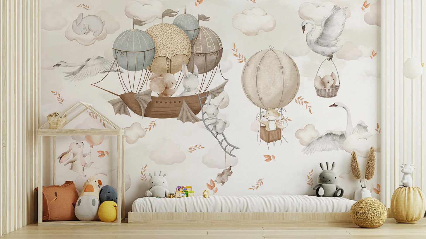 Cloud-Hopping Critters wallpaper mural of bunnies in hot-air balloons above a low daybed and toys in a nursery
