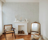 Abstract white symbols on soft grey wallpaper background.
