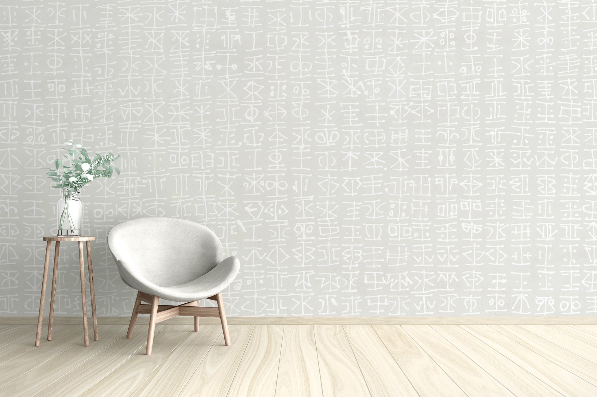 White tribal motif on a light grey wallpaper mural design.

