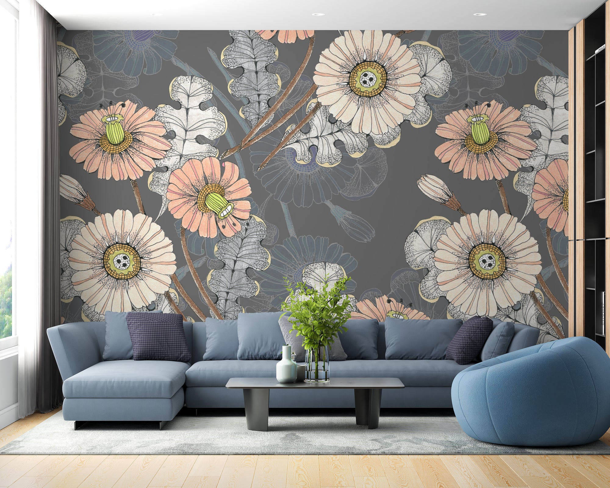 Sketch Flower wallpaper mural with peach and cream blooms on grey behind a blue sectional sofa