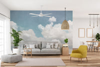 Calm and peaceful nursery room featuring cloud mural