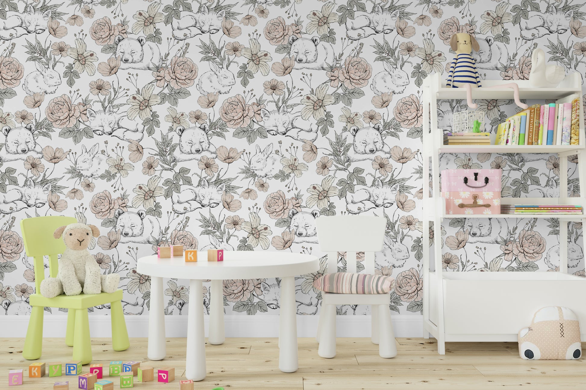 Sleeping Woodland wallpaper mural in a playroom with a round table, green chair and lamb plush