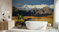 Snowy Peaks Path wallpaper mural of snowcapped mountains and a gravel valley path behind a freestanding bathtub