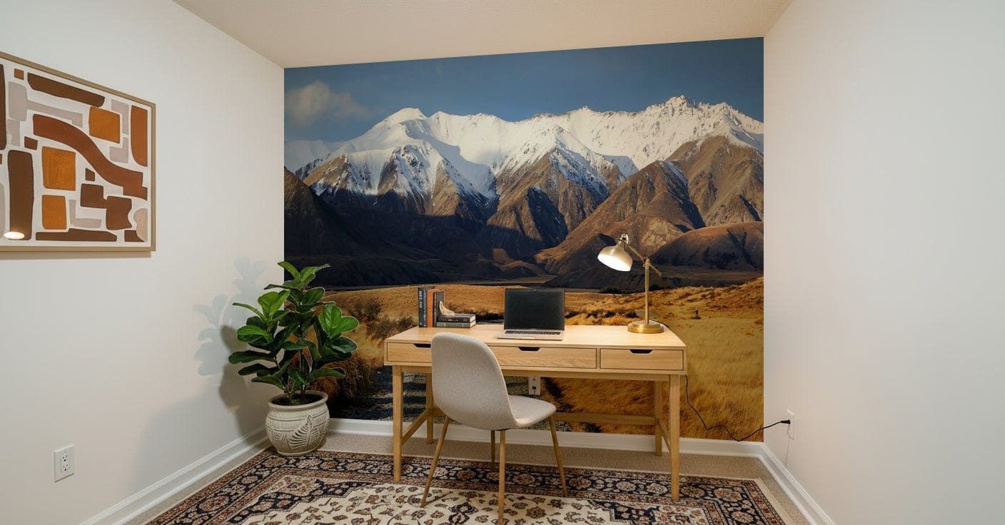 Snowy Peaks Path wallpaper mural of snowy peaks and a valley path behind a wood desk in a home office
