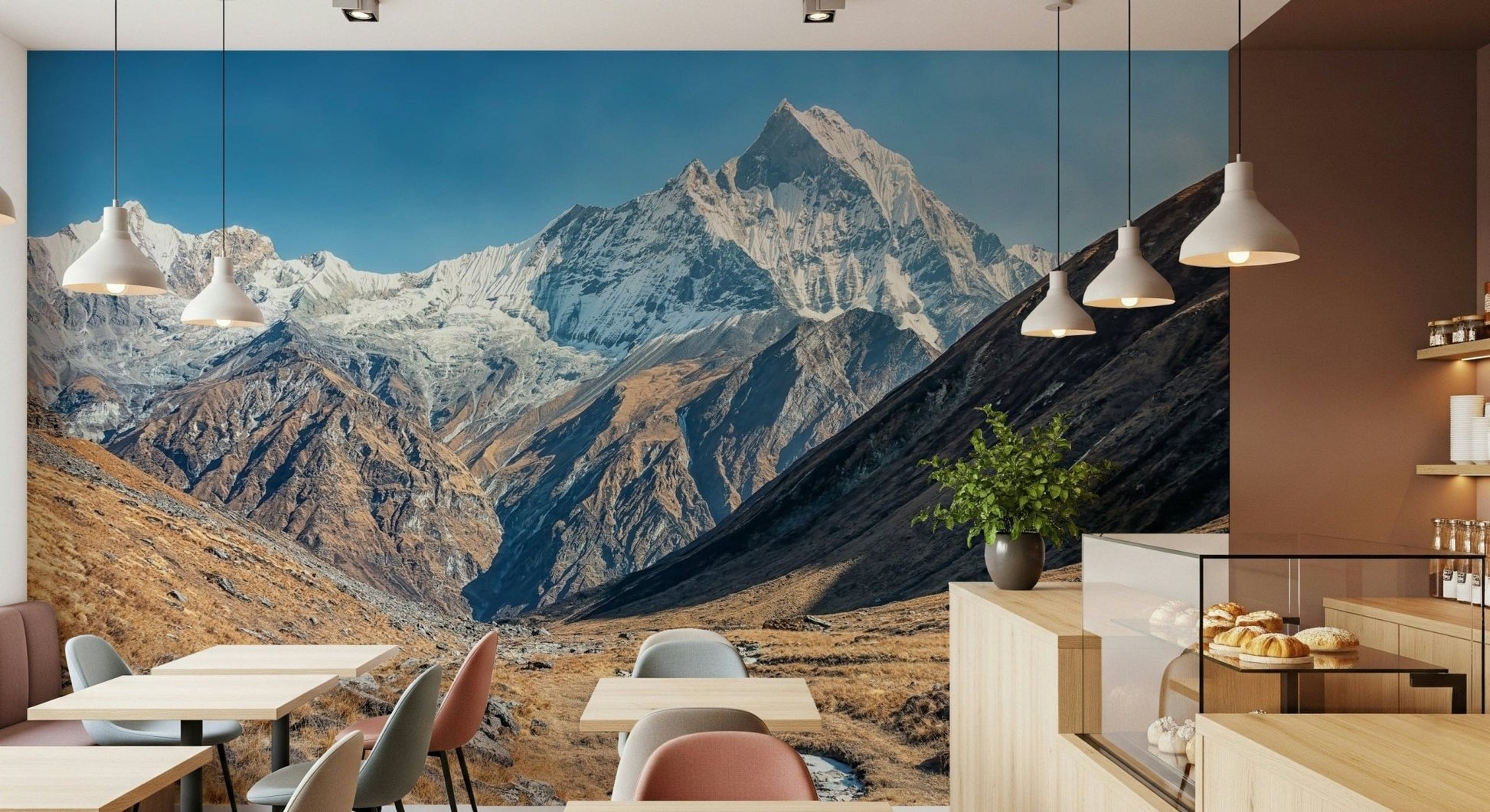 Wide panorama wall mural with mountains and sky behind a modern sofa
