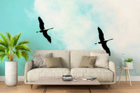 A graceful subtle bird wall mural in cool, natural tones.


