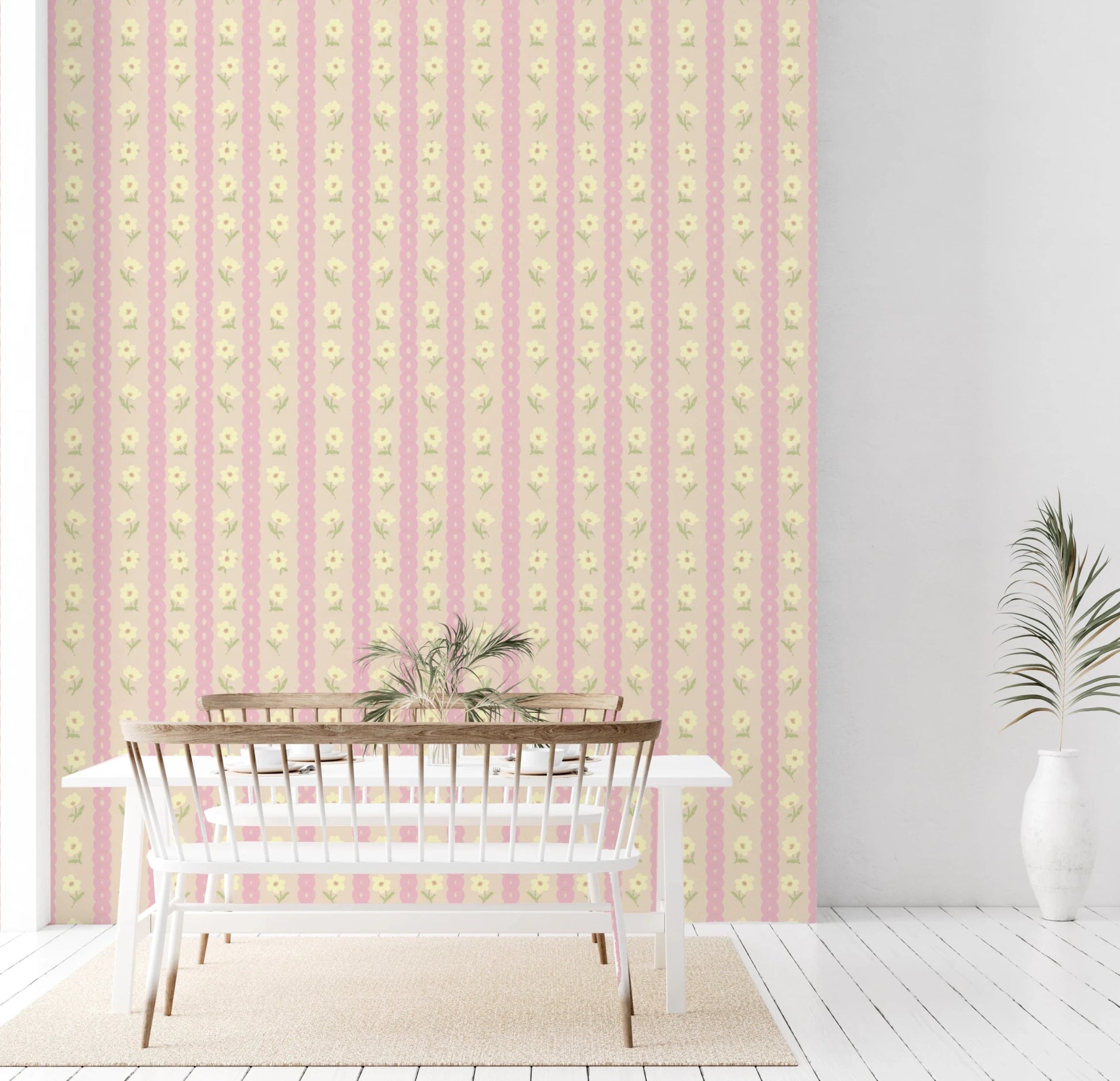 Soft Bloom Stripes wallpaper mural in a dining room behind a white table and bench, pink stripes with yellow flowers