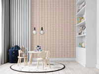 Soft Bloom Stripes wallpaper mural in a kids playroom with wood table and rhino plush, pink and yellow florals