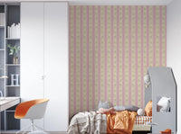 Soft Bloom Stripes wallpaper mural in a kids bedroom with white wardrobe and orange chair, pink floral stripes