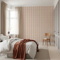 Soft Bloom Stripes wallpaper mural in a bedroom with a white bed and rust throw, pink and yellow floral stripes