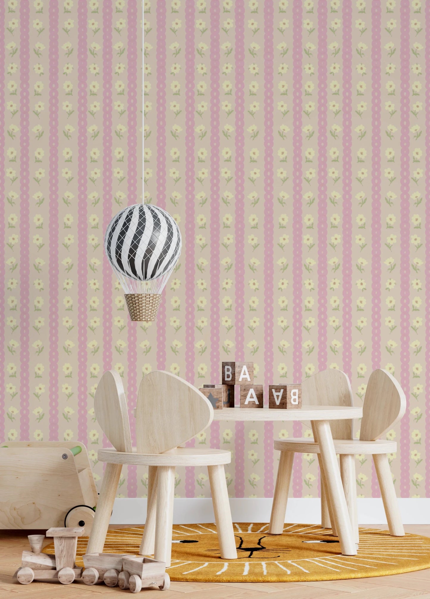 Soft Bloom Stripes wallpaper mural in a kids room with a hot air balloon lamp and sun rug, pink floral stripes