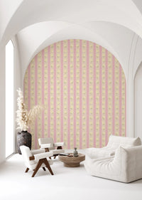Soft Bloom Stripes wallpaper mural on an arched living room wall behind white sofa and armchairs, pink and cream