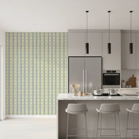 Soft Daisy Stripes wallpaper with sage and blue daisy stripes beside a marble kitchen island and grey bar stools