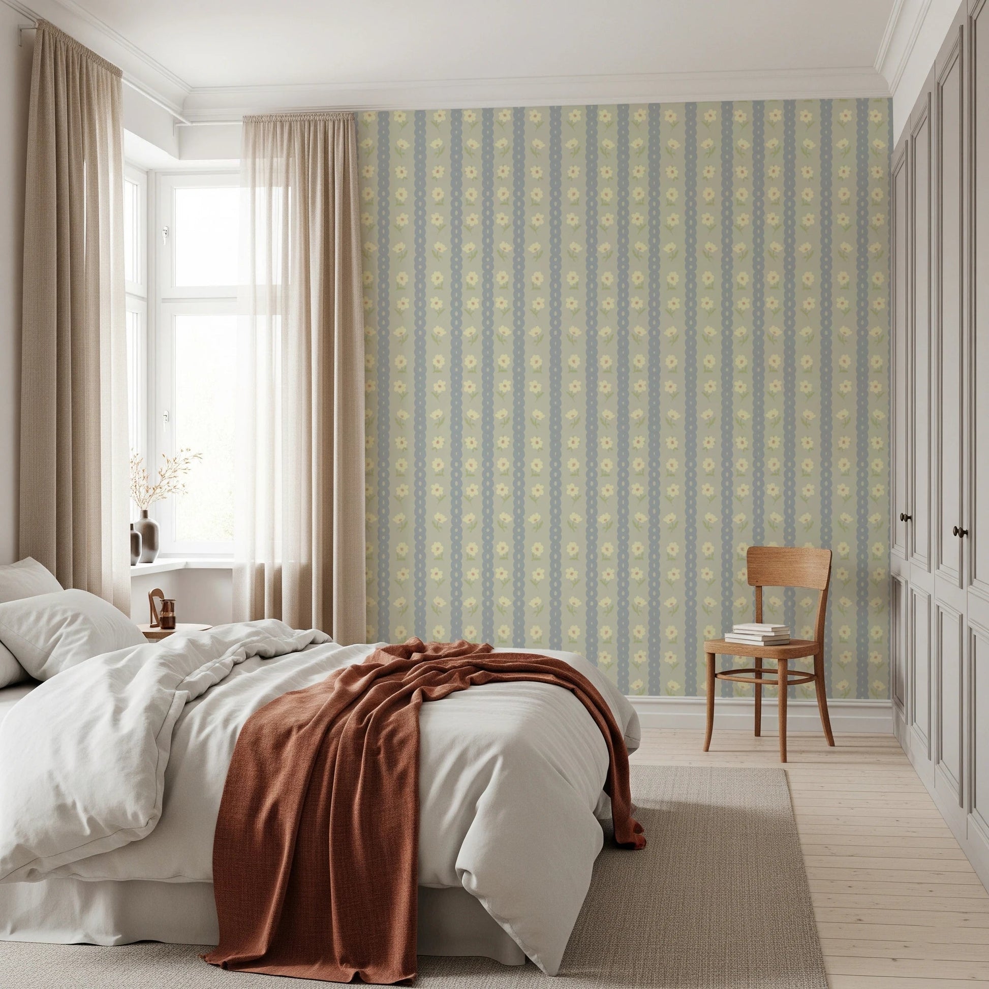 Soft Daisy Stripes wallpaper in green and blue daisy stripes above a white bed with rust throw in a bedroom