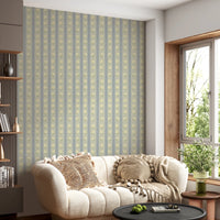 Soft Daisy Stripes wallpaper in blue and yellow daisy stripes behind a cream scalloped boucle sofa in a cozy living room