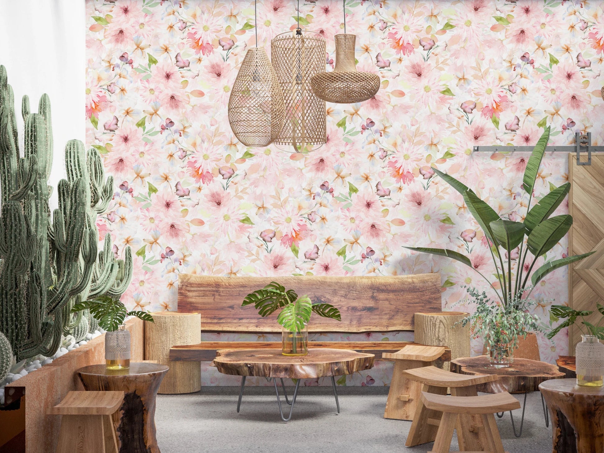 Soft Floral Pink Meadow wallpaper mural with pink daisies above a live-edge wood bench and tall cacti in a lounge seating area