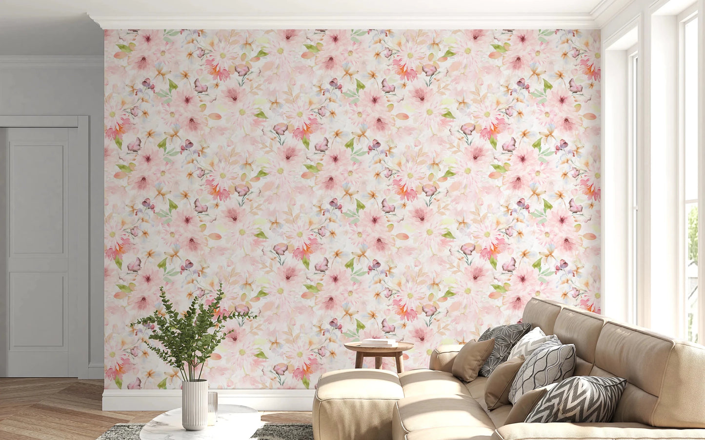 Soft Floral Pink Meadow wallpaper mural of pink daisies behind a cream sofa with grey pillows and a fern in a living room