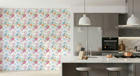 Soft floral wallpaper with hand-painted impasto petals for an artistic wall look.