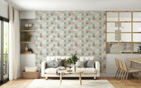 Soft Mosaic Tiles Green Sage wallpaper behind a white sofa beside built-in shelves and dining chairs