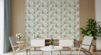 Soft Mosaic Tiles Green Sage wallpaper above a white sideboard with woven chairs and a slatted wood wall