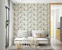 Soft Mosaic Tiles Green Sage wallpaper behind a white loveseat with a chevron pillow near a kitchen