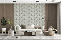 Soft Mosaic Tiles Green Sage wallpaper between wood panels behind a cream curved sofa and swivel chair
