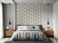 Soft Mosaic Tiles Green Sage wallpaper as a headboard accent behind a grey bed with walnut nightstands