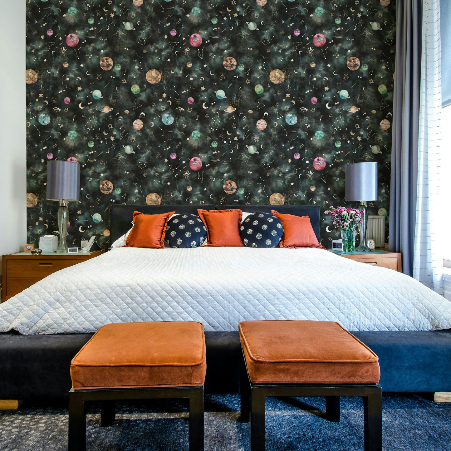 Wallpaper depicting the beauty of the universe with planets and stars on a blue canvas.

